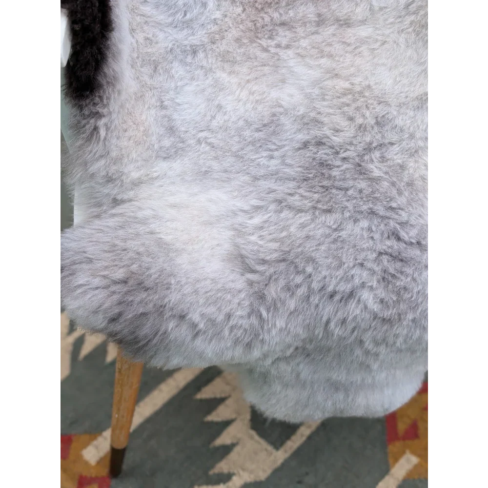 A plush soft gray long wool icelandic sheepskin rug with natural fluffy texture by angus oliver