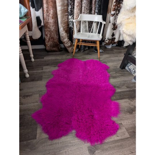 Vibrant hot pink Angus Oliver sheepskin rug, plush 64x39 quad size