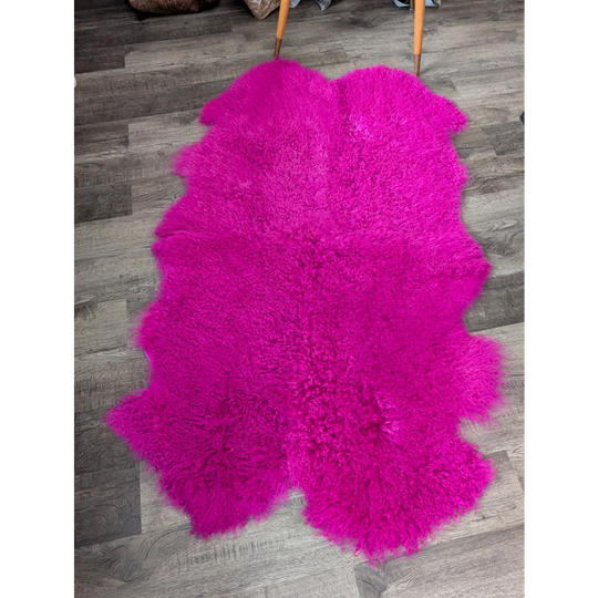 Vibrant hot pink Angus Oliver sheepskin rug, fluffy 64x39 quad size