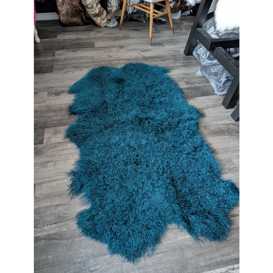 Plush dark teal Angus Oliver sheepskin rug, 67x40 inches, curly texture