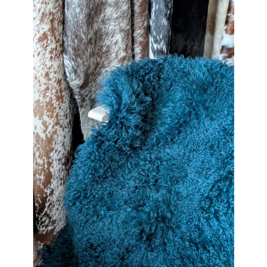 Vibrant dark teal curly fur throw blanket by Angus Oliver sheepskin