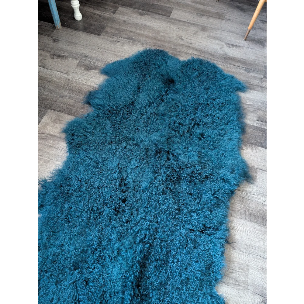 Dark teal Angus Oliver 67x40 sheepskin rug with curly texture