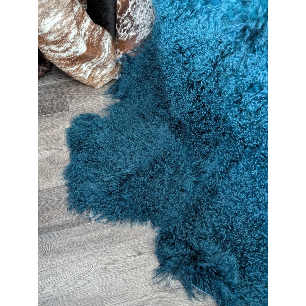 Vibrant dark teal curly-furred Angus Oliver sheepskin rug, plush shaggy texture