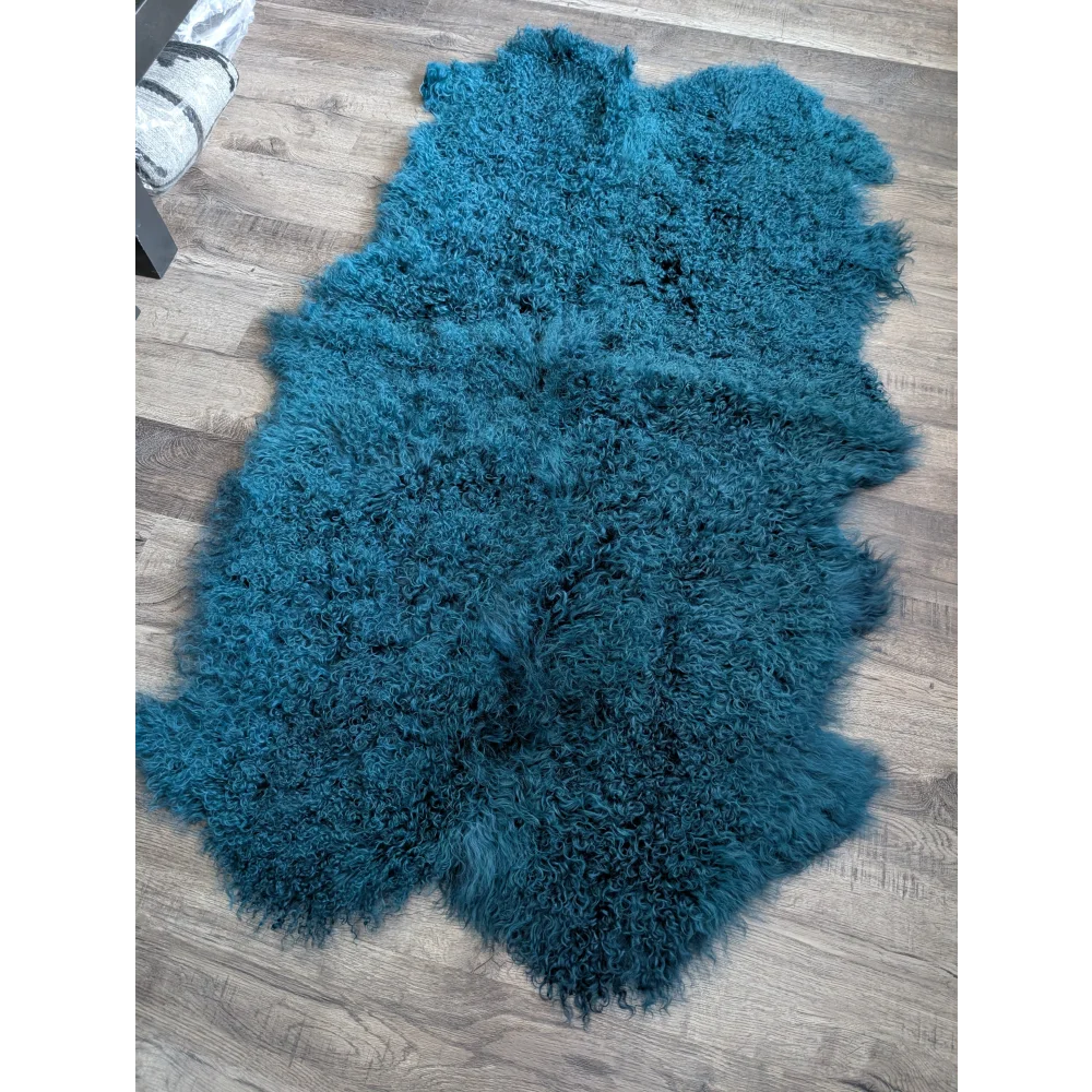 Cozy dark teal Angus Oliver sheepskin rug, 67x40 inches, curly plush texture