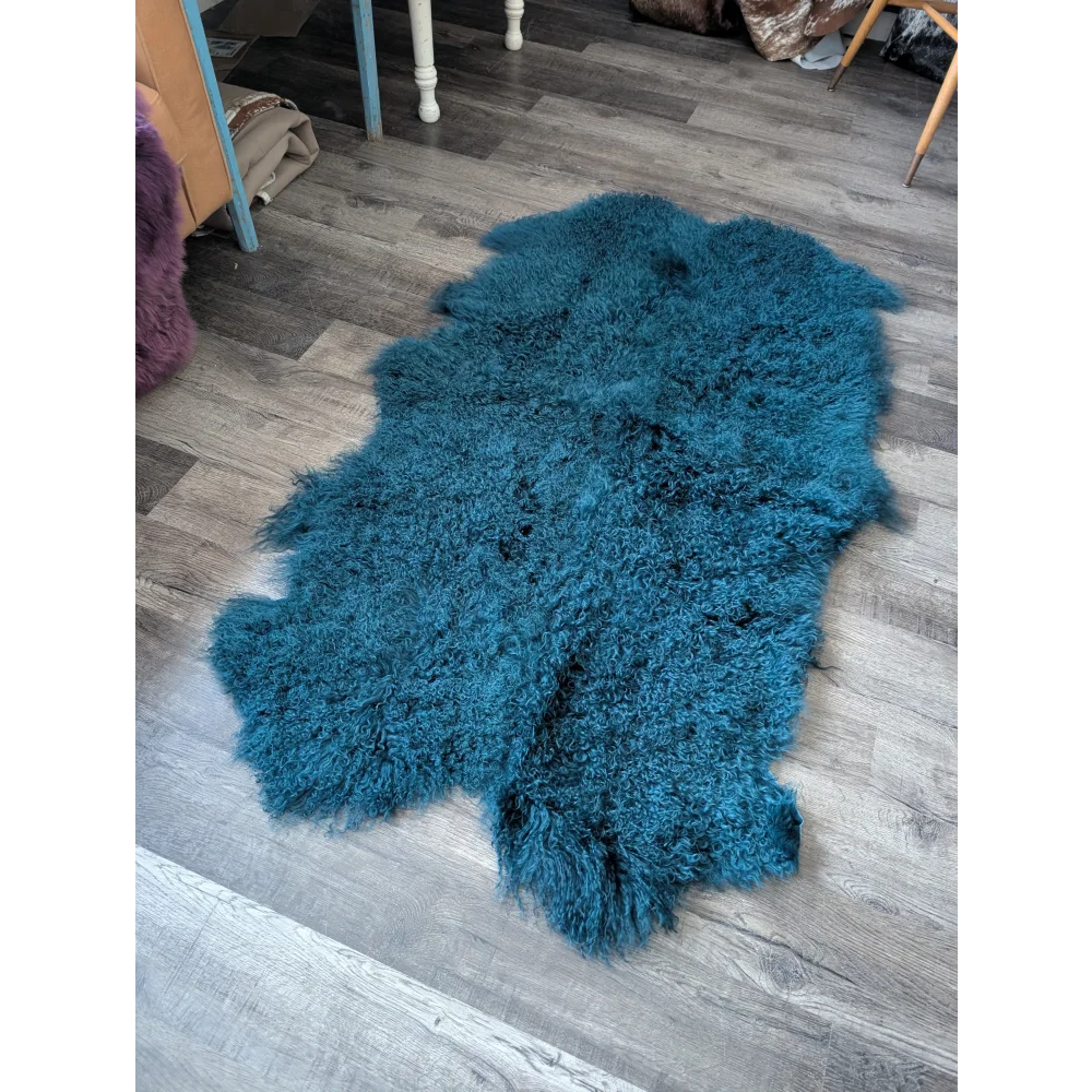 Plush dark teal Angus Oliver sheepskin rug, 67x40 inches, curly fur
