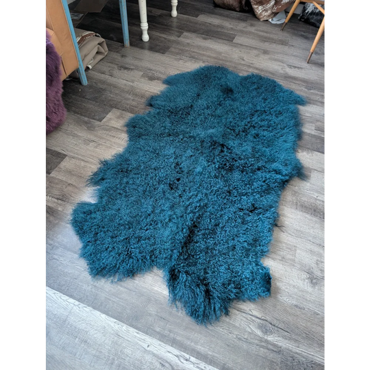 Plush dark teal Angus Oliver sheepskin rug, 67x40 inches, curly fur