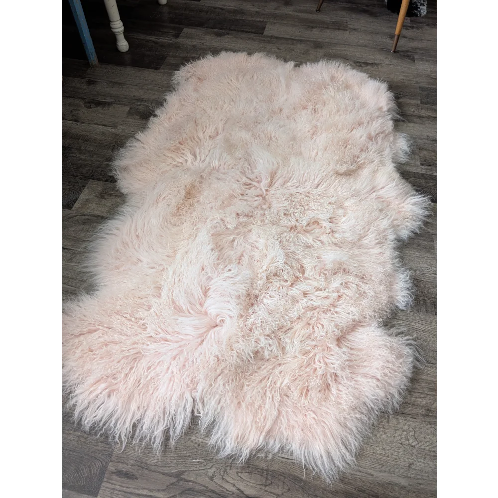 Blush pink Angus Oliver sheepskin rug, fluffy 69x43 inch quad size