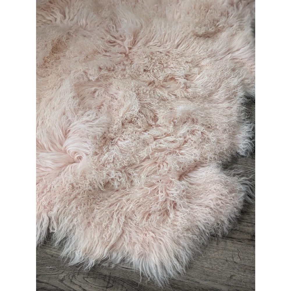 Blush pink Angus Oliver sheepskin rug, 69x43 curly fluffy texture