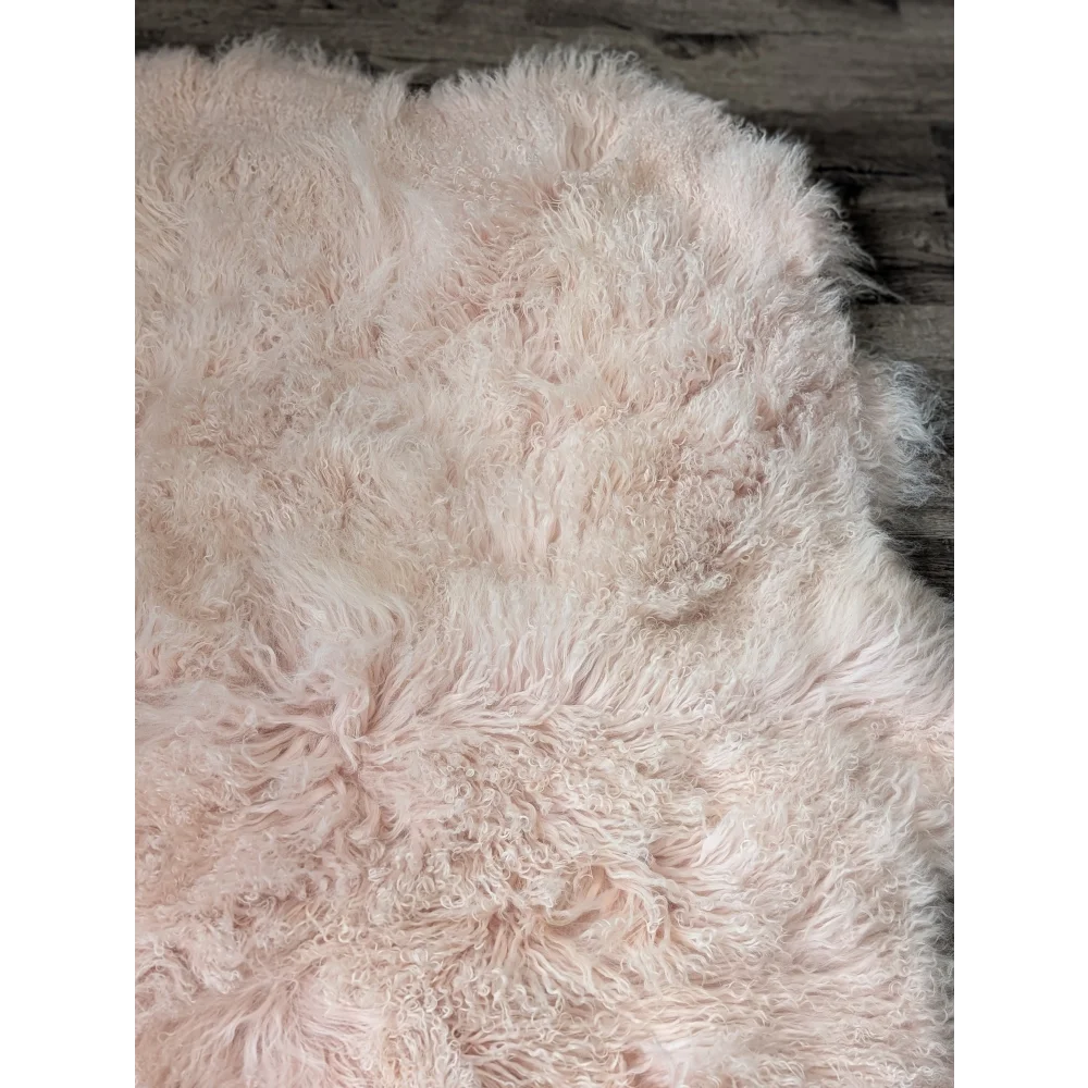 Blush pink quad sized Angus Oliver sheepskin rug, 69x43 inches