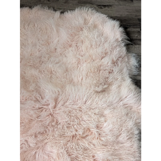 Blush pink quad sized Angus Oliver sheepskin rug, 69x43 inches
