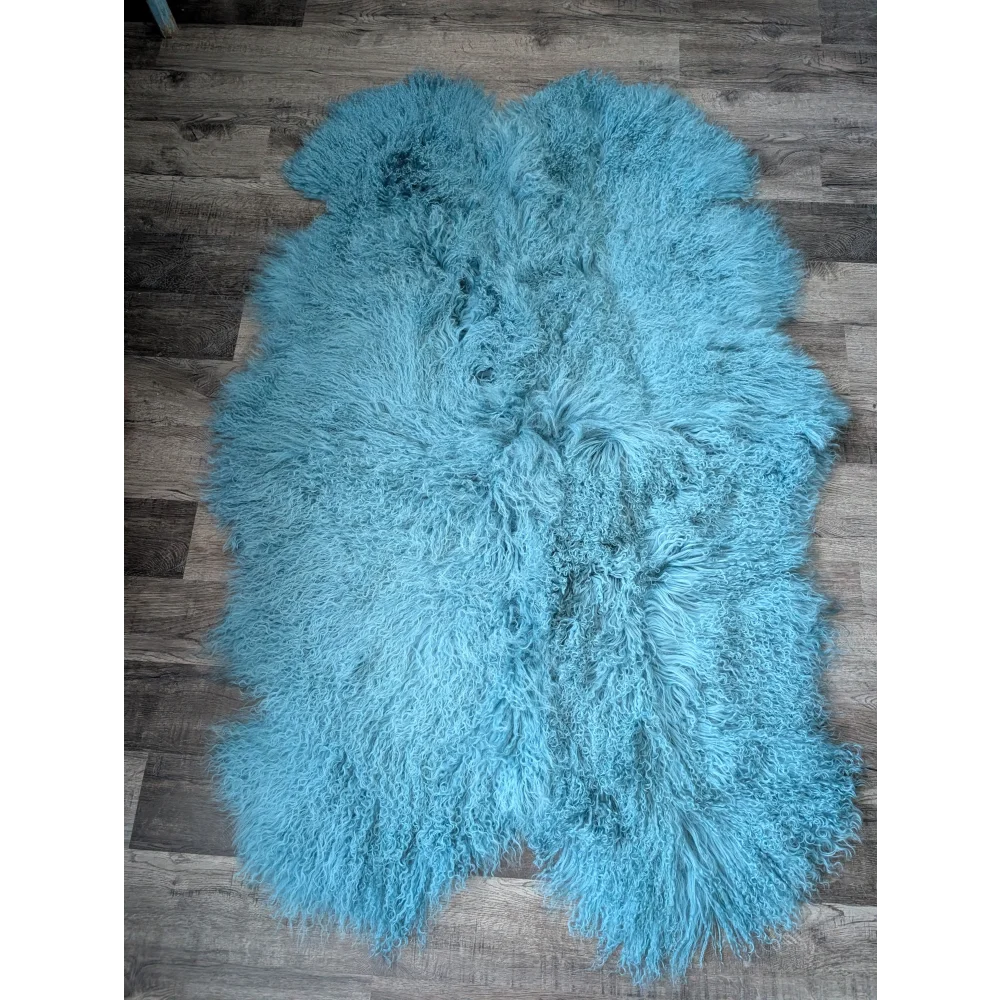 Gorgeous 71x49in aqua Mongolian sheepskin rug on wood floor