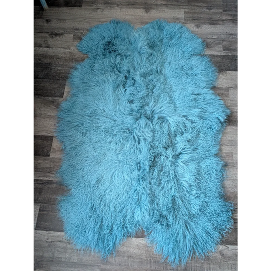 Gorgeous 71x49in aqua Mongolian sheepskin rug on wood floor