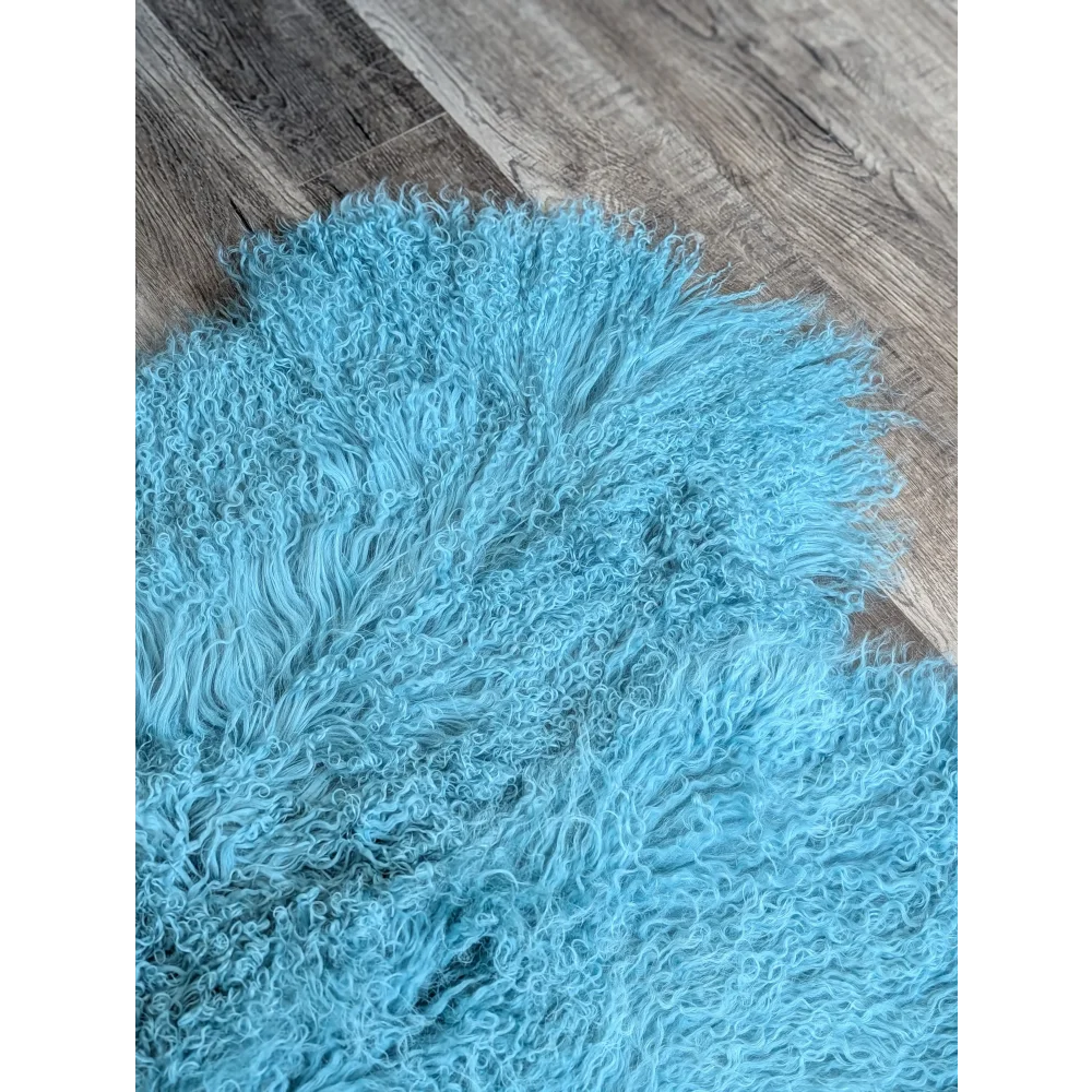 Gorgeous 71x49in aqua Mongolian sheepskin rug on wood floor