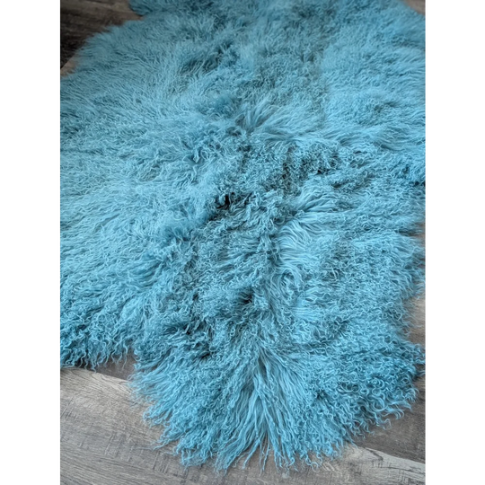 Gorgeous 71’’ x 49’’ aqua Mongolian sheepskin rug with curly texture