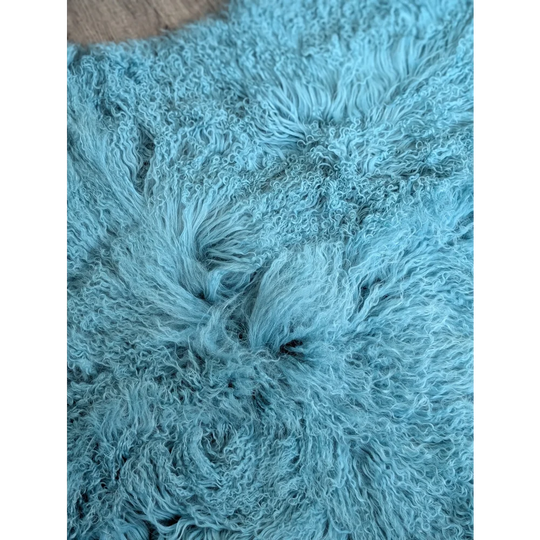 Gorgeous 71x49in aqua Mongolian sheepskin rug with curly light blue fur