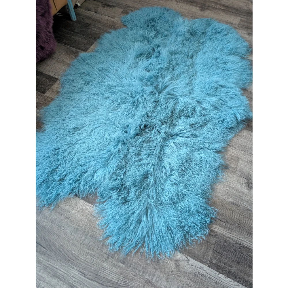 Gorgeous 71x49in aqua Mongolian sheepskin rug on wood floor