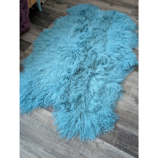 Gorgeous 71x49in aqua Mongolian sheepskin rug on wood floor