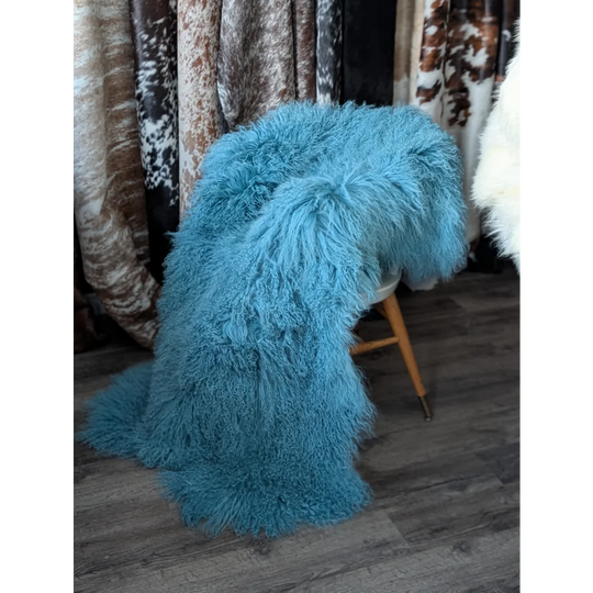 Vibrant turquoise sheepskin rug, 71x49in gorgeous Mongolian throw on stool