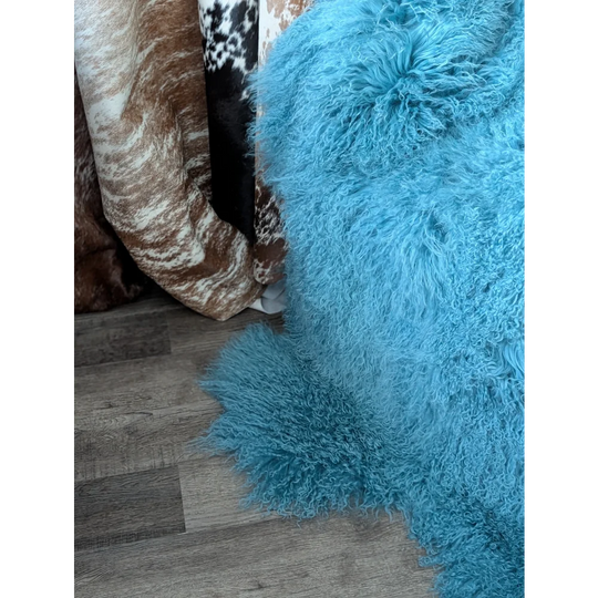 Vibrant turquoise 71x49in plush Mongolian sheepskin rug for natural home decor