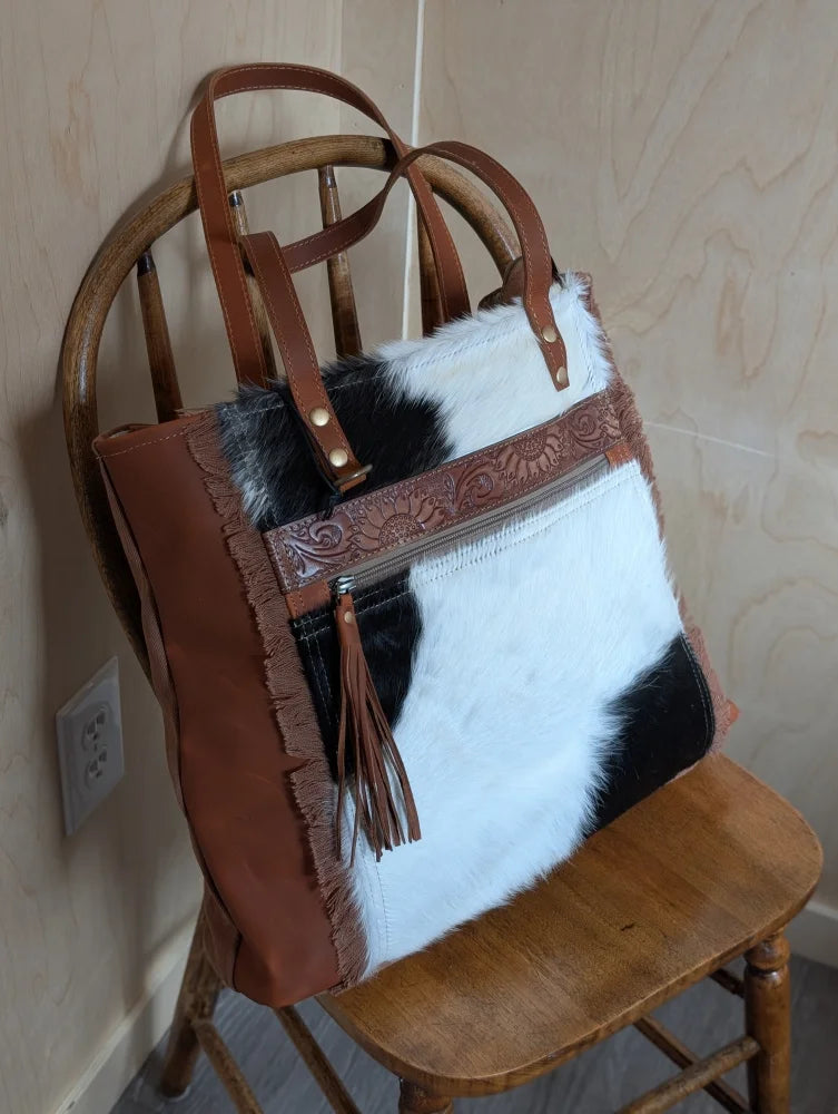 #1 oakley bag spacious brown and black real cowhide patchwork tote with frayed edges leather straps and tassel pull