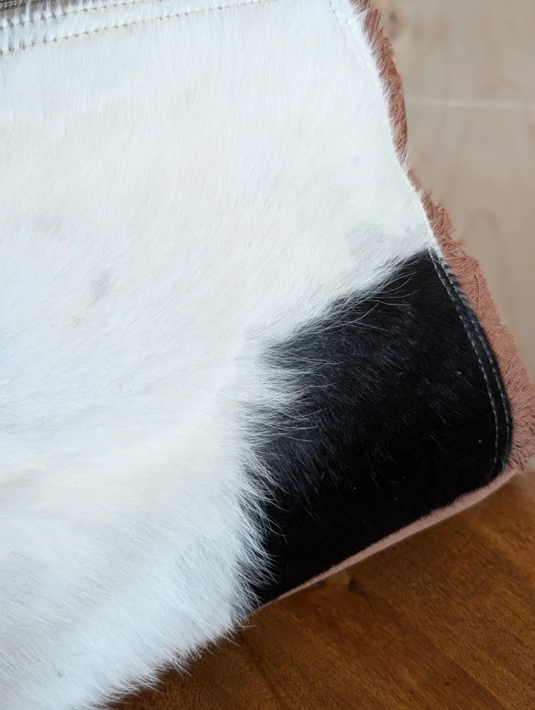 Oakley bag with a plush two-toned real cowhide cushion in soft white and black fur with a pinkish edge
