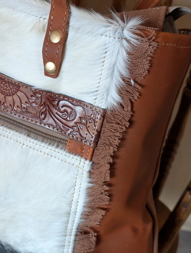 #1 oakley bag with brown real cowhide leather strap, gold hardware, embossed floral pattern, white fur trim, spacious bag