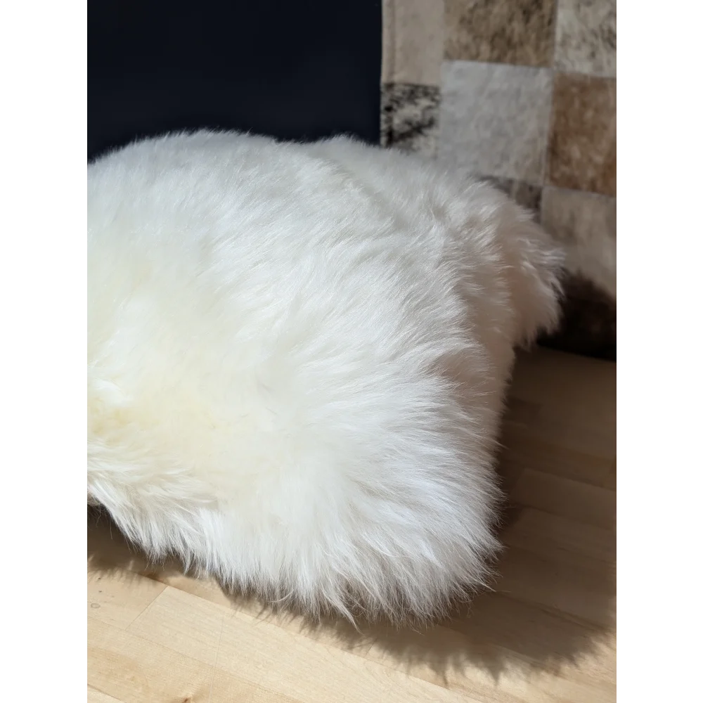 White fluffy merino sheepskin throw blanket with long soft fibers by angus oliver canada perfect for cozy spaces