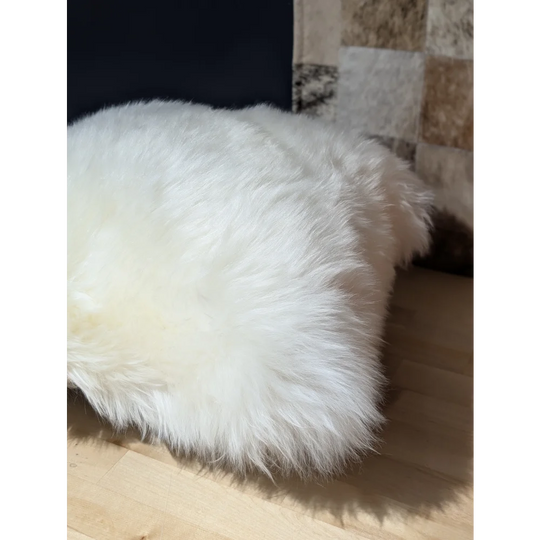 White fluffy merino sheepskin throw blanket with long soft fibers by angus oliver canada perfect for cozy spaces