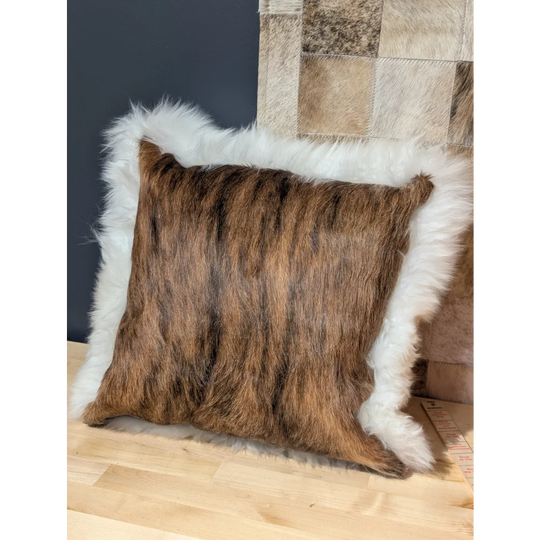 Brown and black striped cowhide pillow with plush white merino sheepskin trim by angus oliver canada