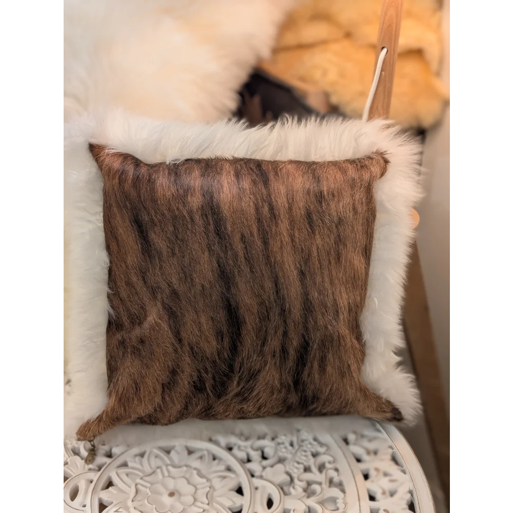 Brown faux fur throw pillow with plush white fleece border made from merino sheepskin by angus oliver canada