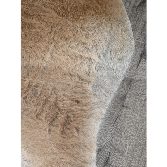 Plush tan extra large cowhide rug with soft faux fur and natural gradient perfect for adding rustic charm to any room