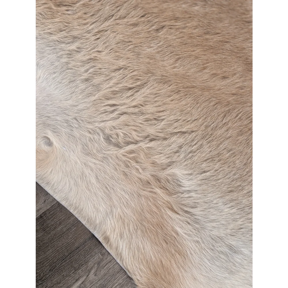 Beige and white extra large cowhide rug with beautiful rustic charm and natural textured fur surface