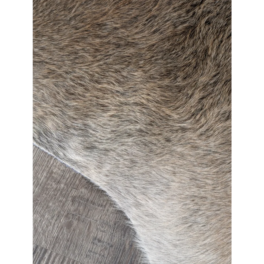 Extra large cowhide rug with soft brown and gray faux fur offering rustic charm and beautiful rugs for any space
