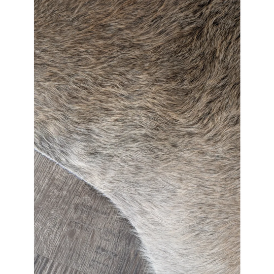 Extra large cowhide rug with soft brown and gray faux fur offering rustic charm and beautiful rugs for any space