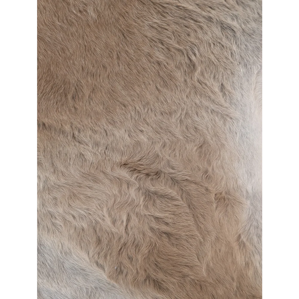 A soft fluffy beige faux fur extra large cowhide rug with rustic charm perfect for beautiful rugs collection