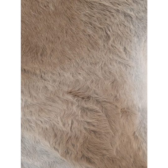A soft fluffy beige faux fur extra large cowhide rug with rustic charm perfect for beautiful rugs collection