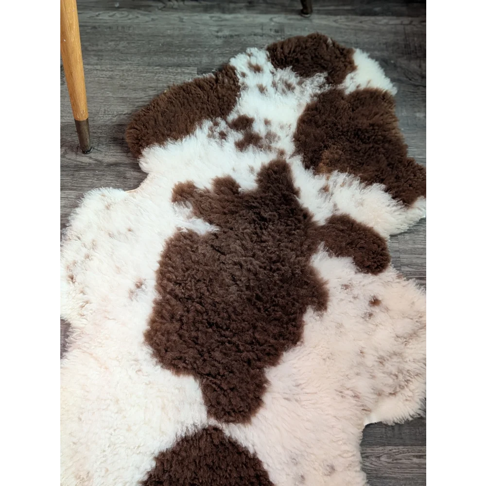 Brown and white cow-print highland spotted sheepskin rug grade a- sheepskins perfect for cozy decor
