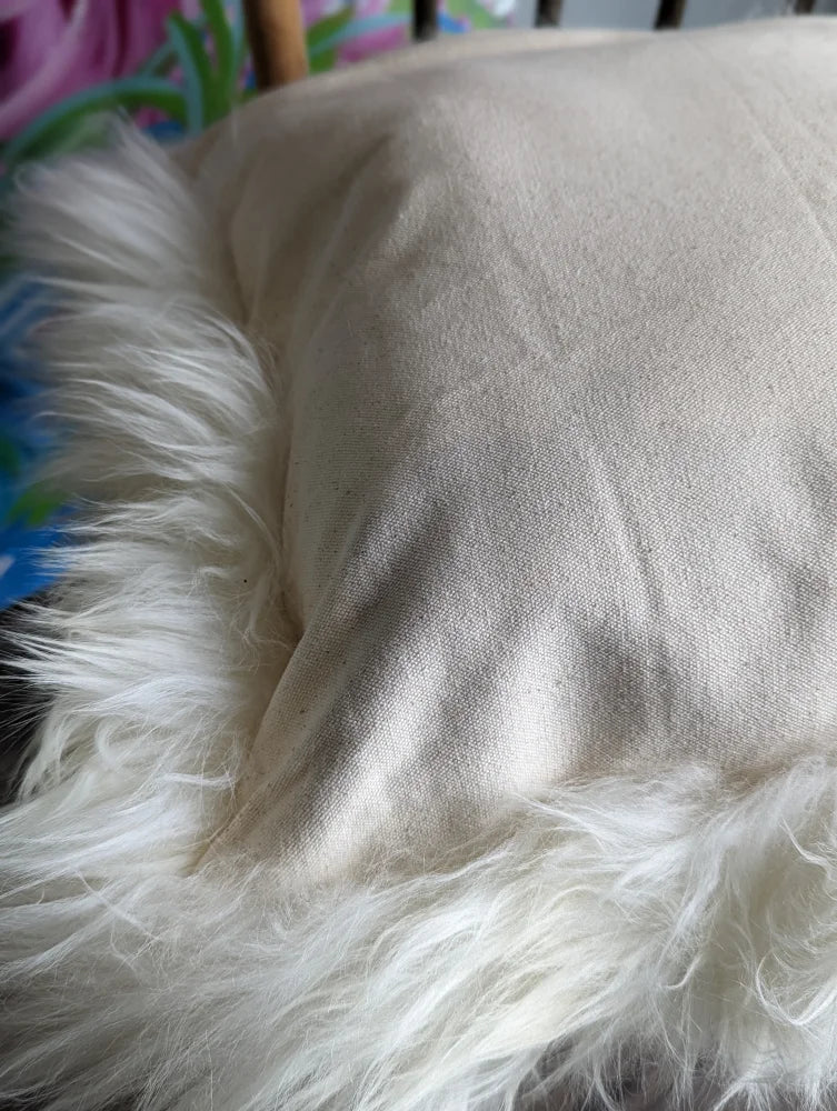 Soft cream faux fur throw in natural white merino sheepskin cushion style