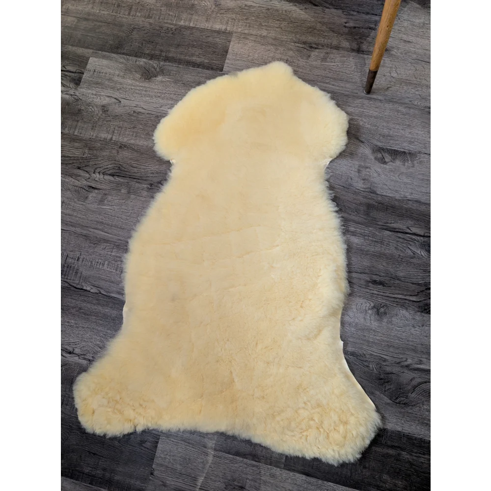 Soft cream-colored medical sheepskin rug, shearling wool boosts blood flow, 44x23.5in