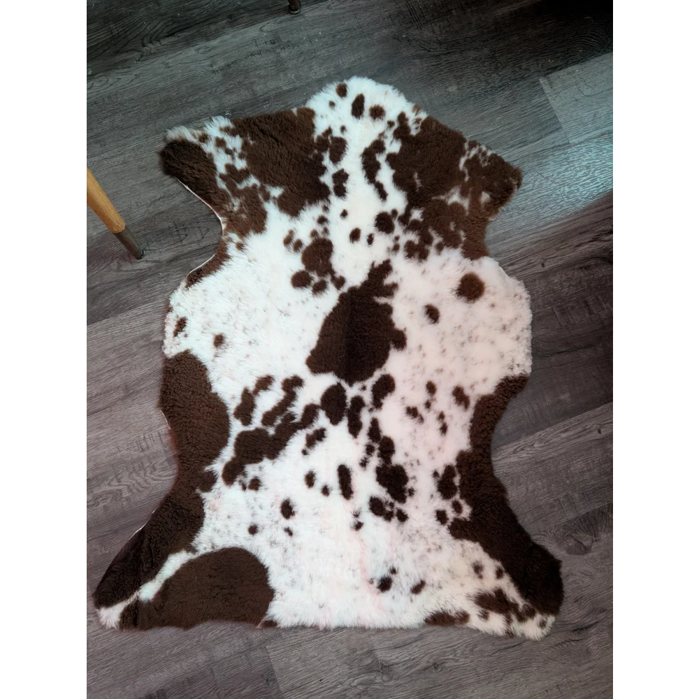 Brown and white tibet highland spotted grade a- sheepskin rug with natural fluffy texture and soft feel