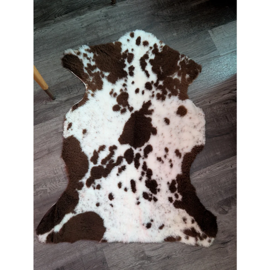 Brown and white tibet highland spotted grade a- sheepskin rug with natural fluffy texture and soft feel