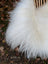 A plush natural white icelandic sheepskin throw with long wool strands and fluffy soft texture