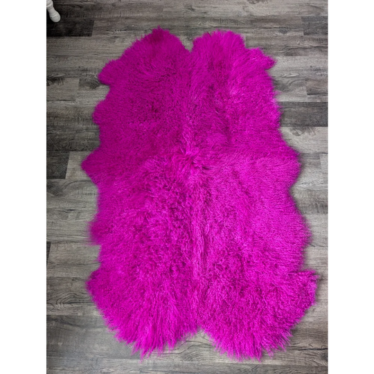 Vibrant hot pink fluffy sheepskin rug, 65x42 quad size by Angus Oliver