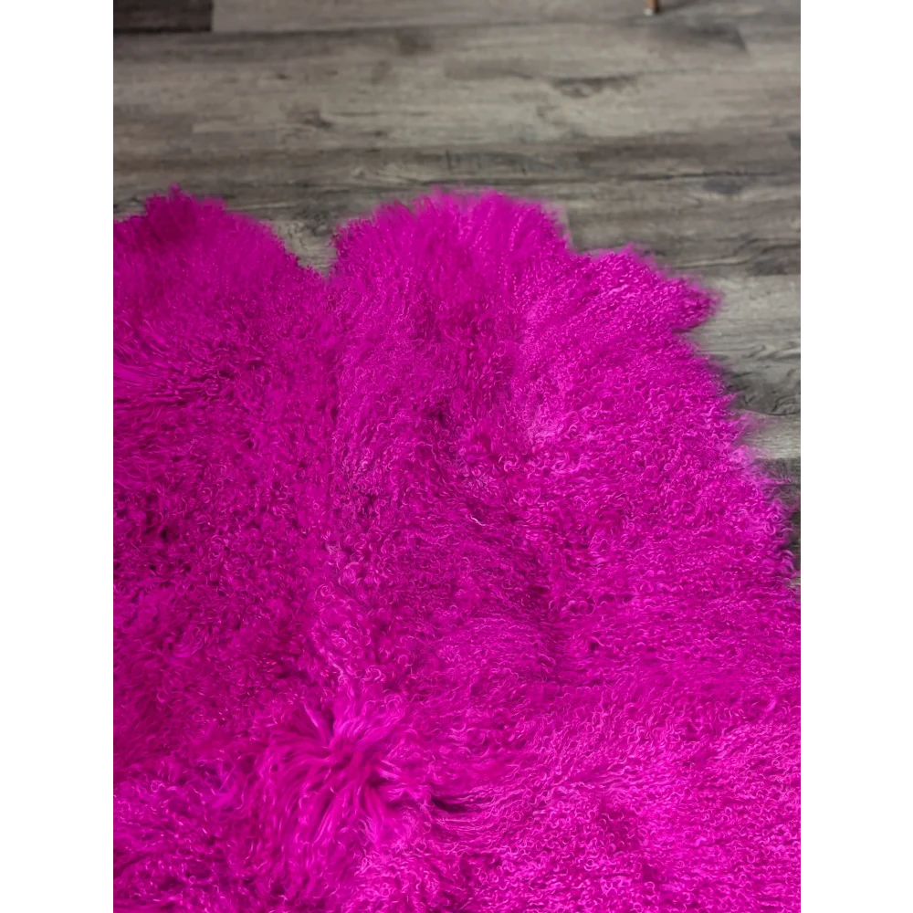 Vibrant hot pink Angus Oliver sheepskin shaggy rug, plush curly texture