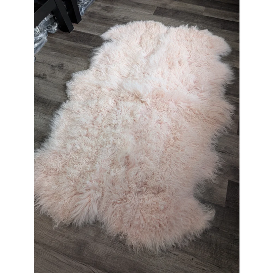 Blush pink Angus Oliver sheepskin rug, 68x45 fluffy Mongolian style