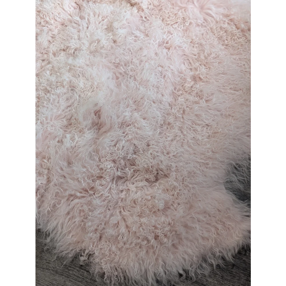 Blush pink Angus Oliver sheepskin rug, 68x45 fluffy curly texture
