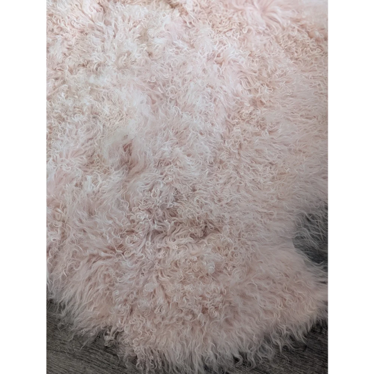 Blush pink Angus Oliver sheepskin rug, 68x45 fluffy curly texture