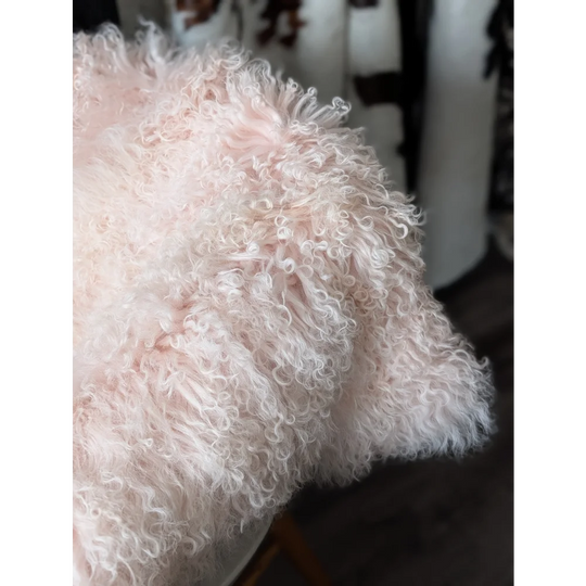 Blush pink Angus Oliver sheepskin throw with fluffy long fibers, 68x45 inches