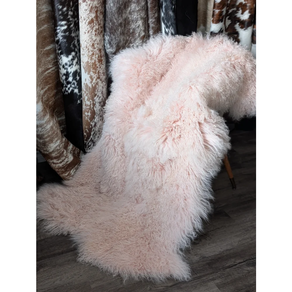 Blush pink Angus Oliver 68x45 sheepskin rug on wooden chair