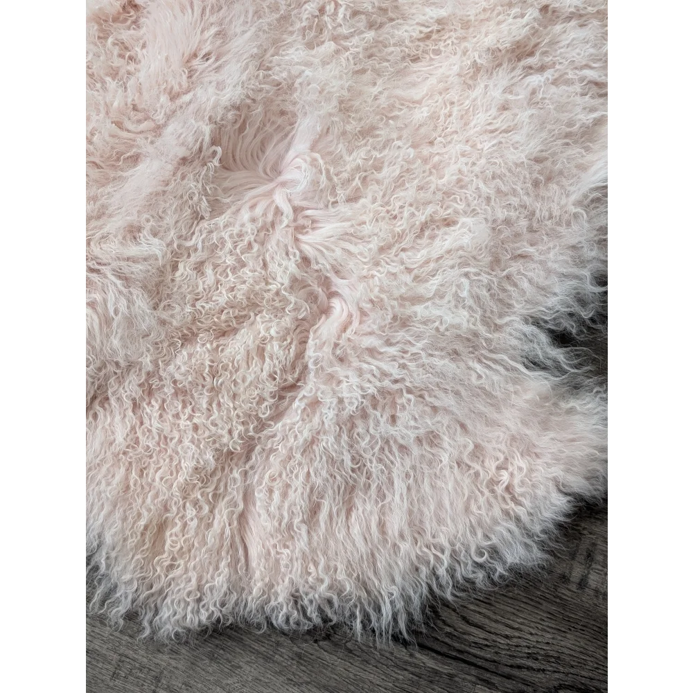 Blush pink 68x45 inch fluffy sheepskin rug by Angus Oliver